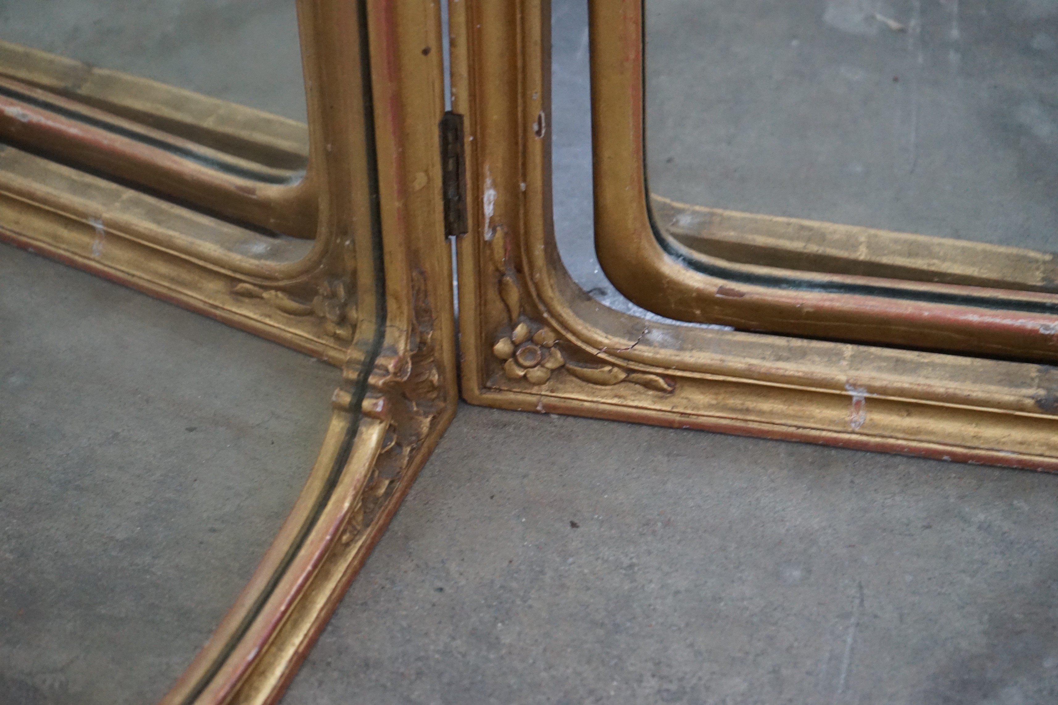 An early 20th century carved giltwood triptych dressing table mirror, width 136cm, height 89cm